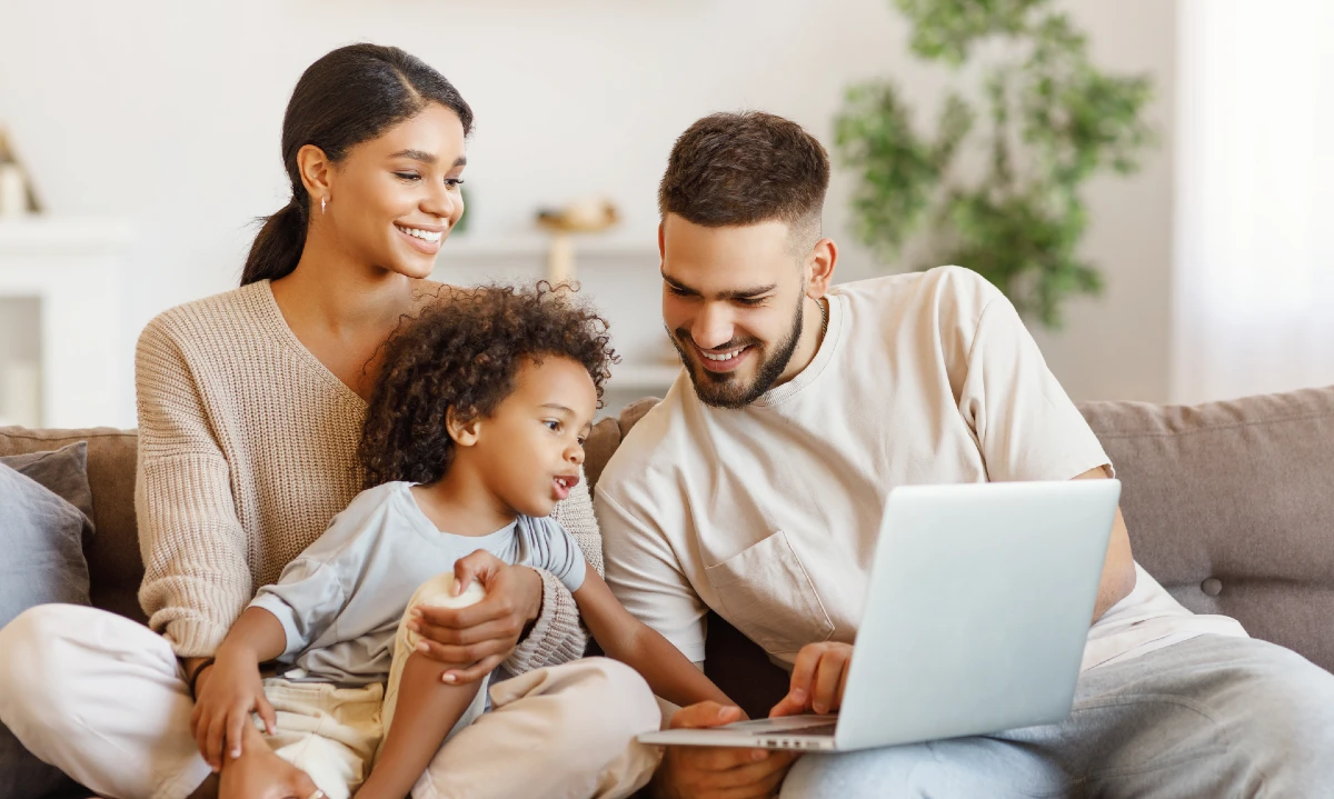 Image of family using a laptop